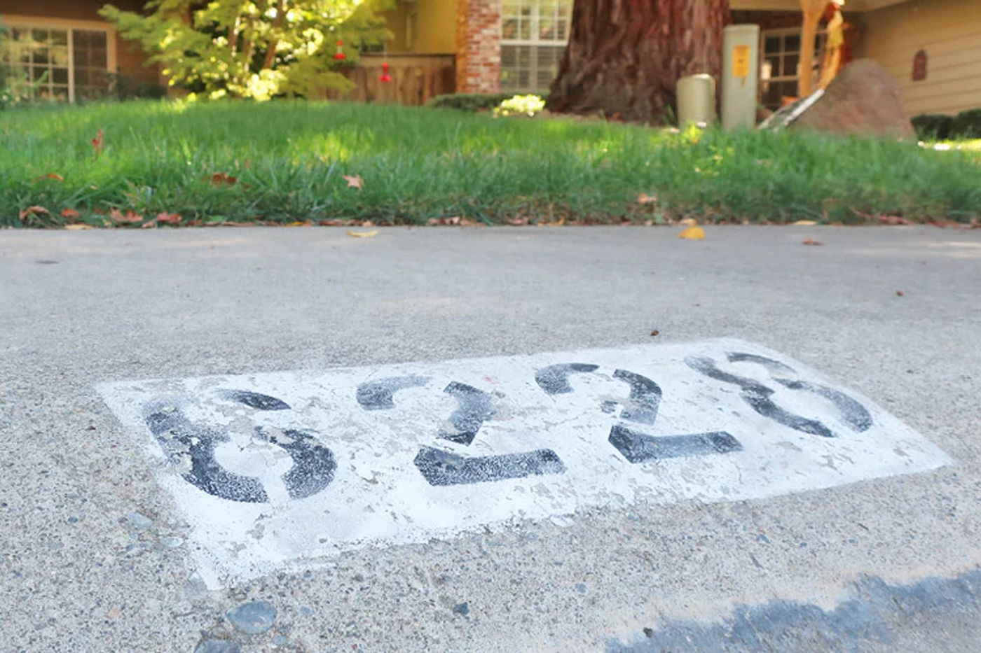 painted curb address on curb