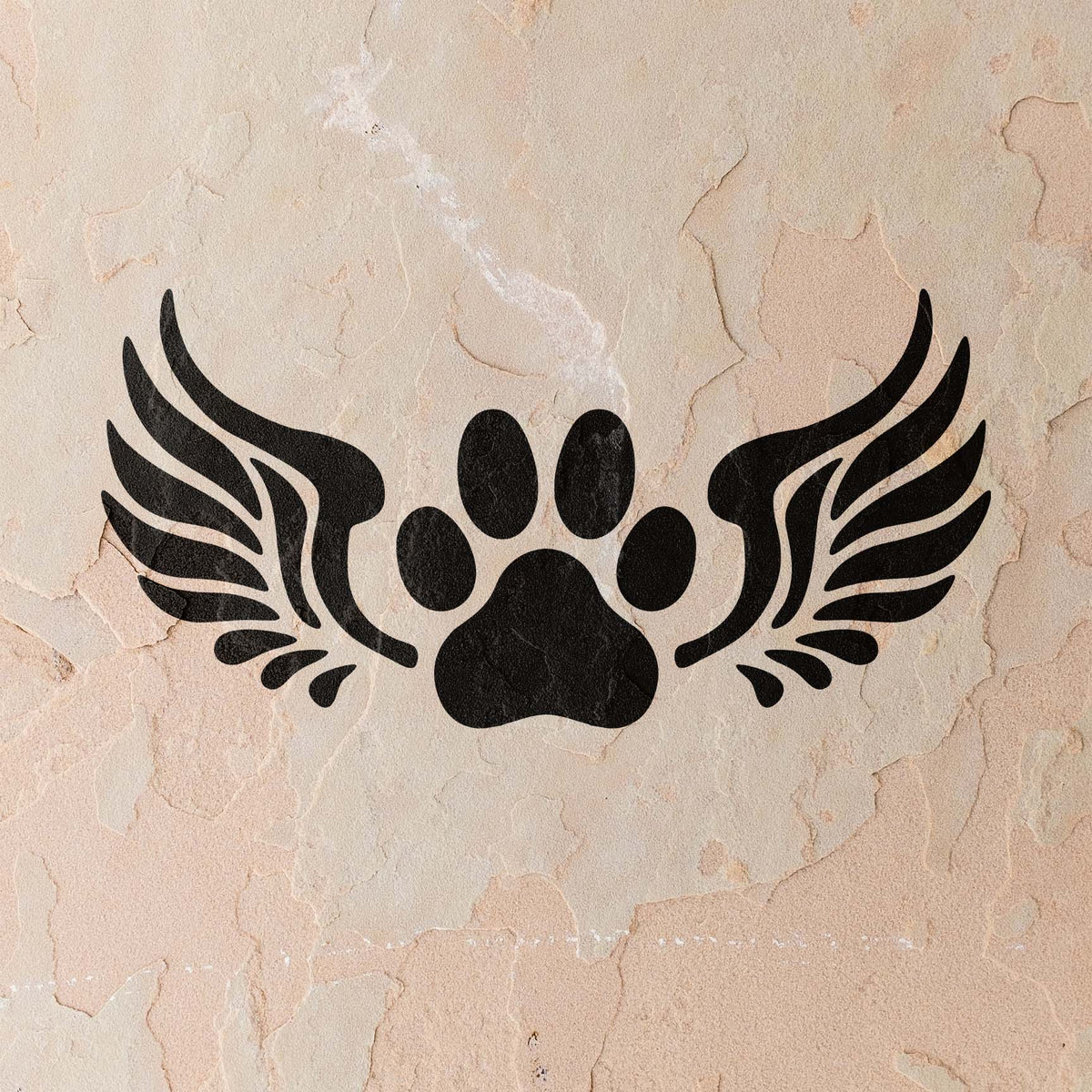 A weathered stucco wall displays the Angel Wings Paw Print Memorial Stencil in solid black