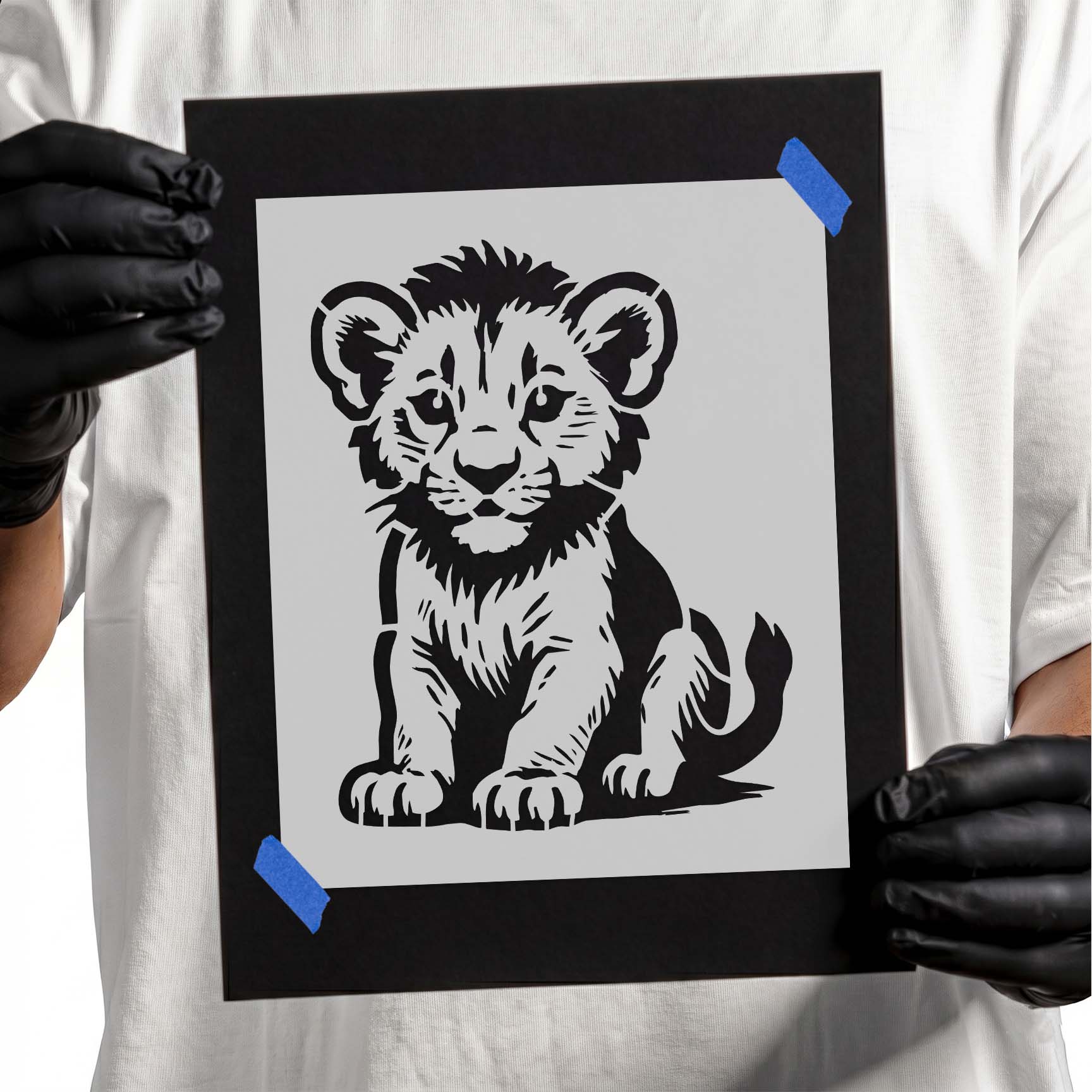 Cute sitting lion cub stencil with fluffy fur, expressive eyes, and playful wildlife design