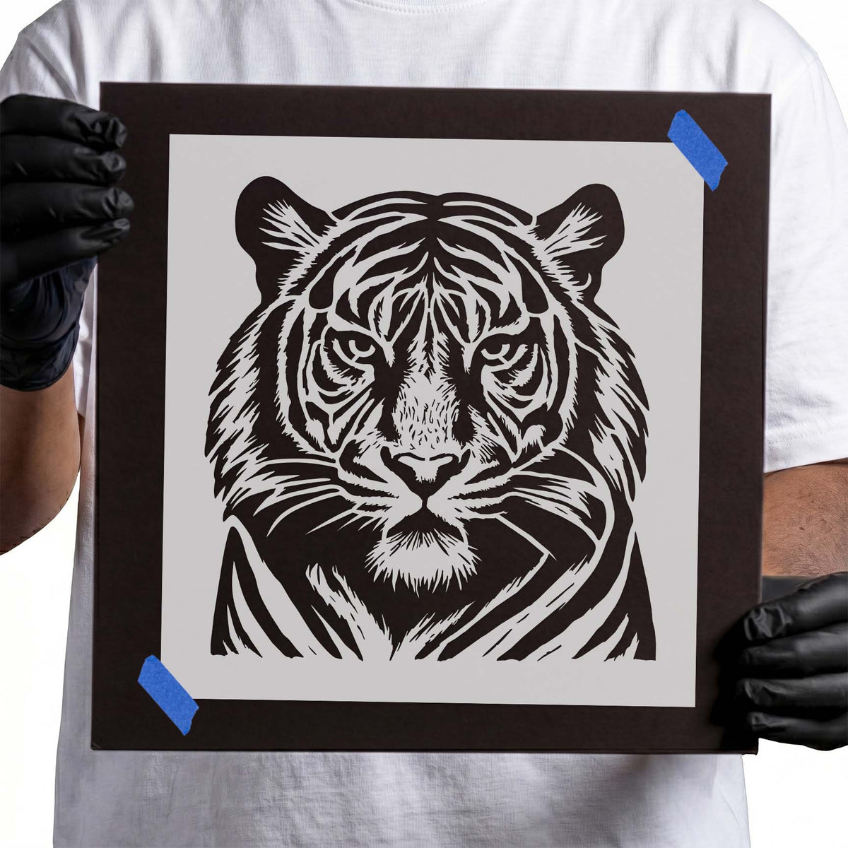 Detailed front-facing tiger face with bold striped markings stencil