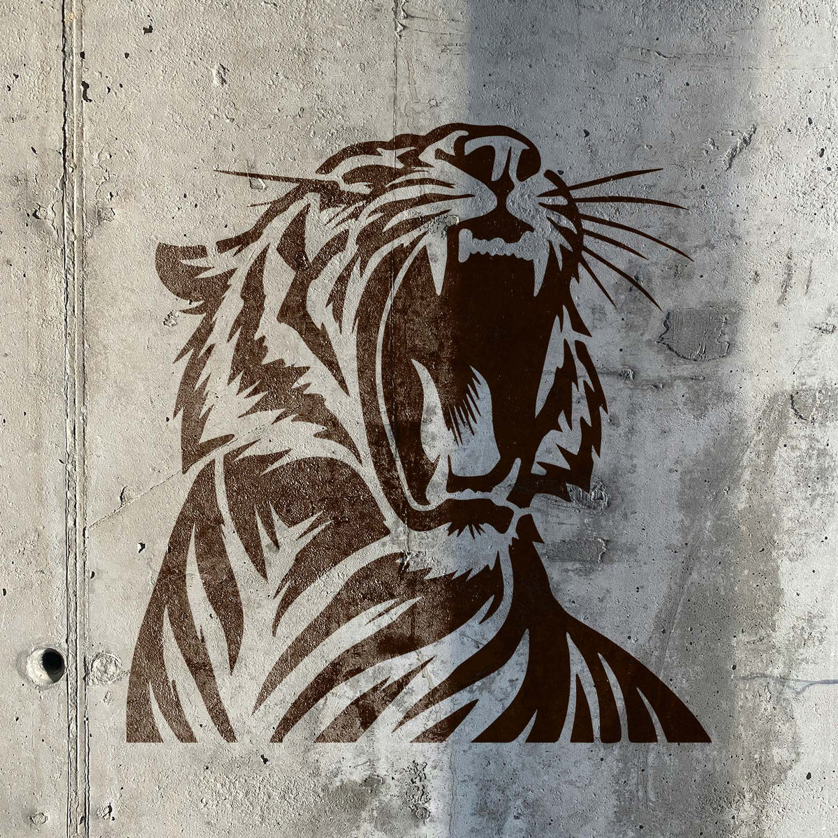 Fierce Roaring Tiger stencil painted on a textured concrete wall
