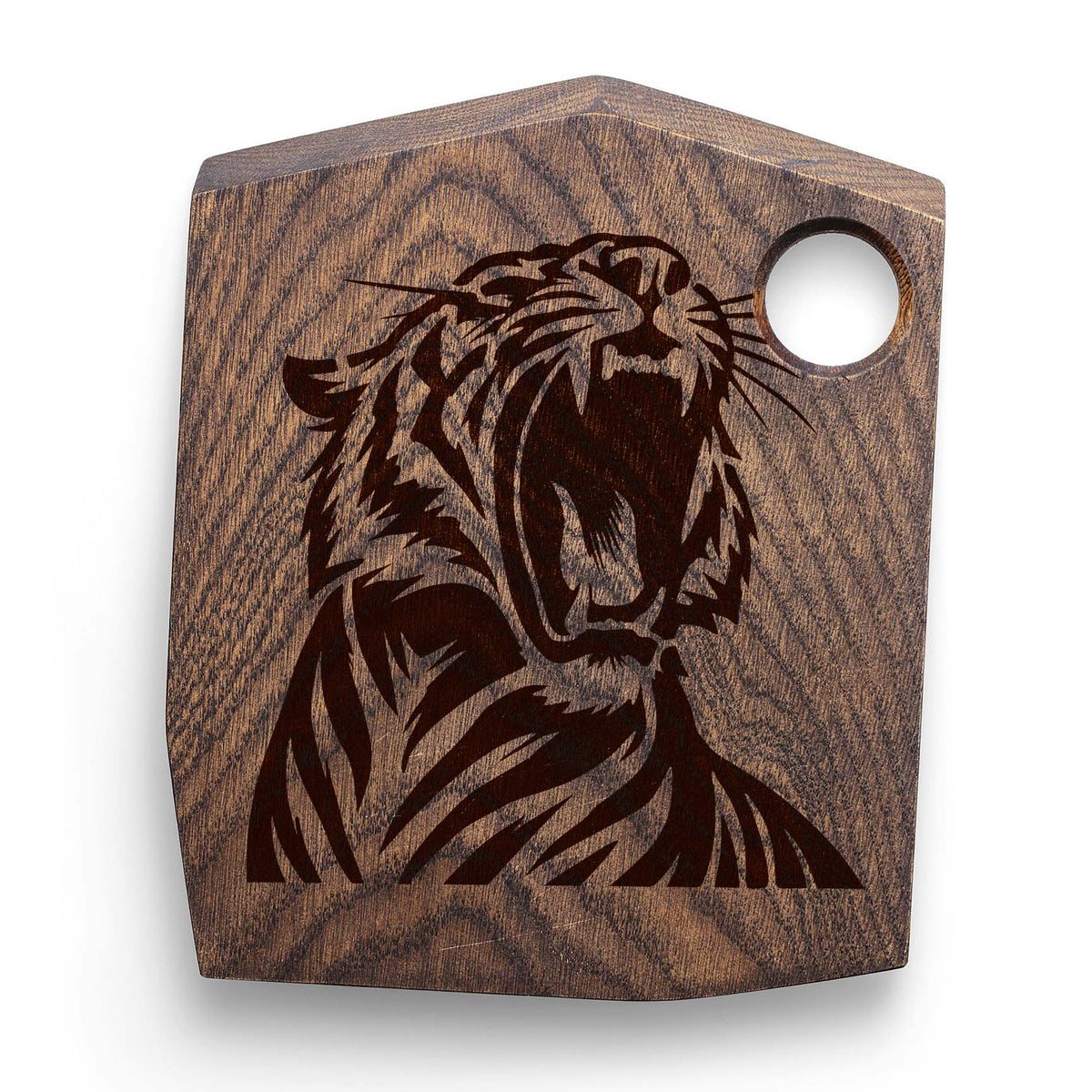 Fierce Roaring Tiger stencil painted on a dark wooden cutting board