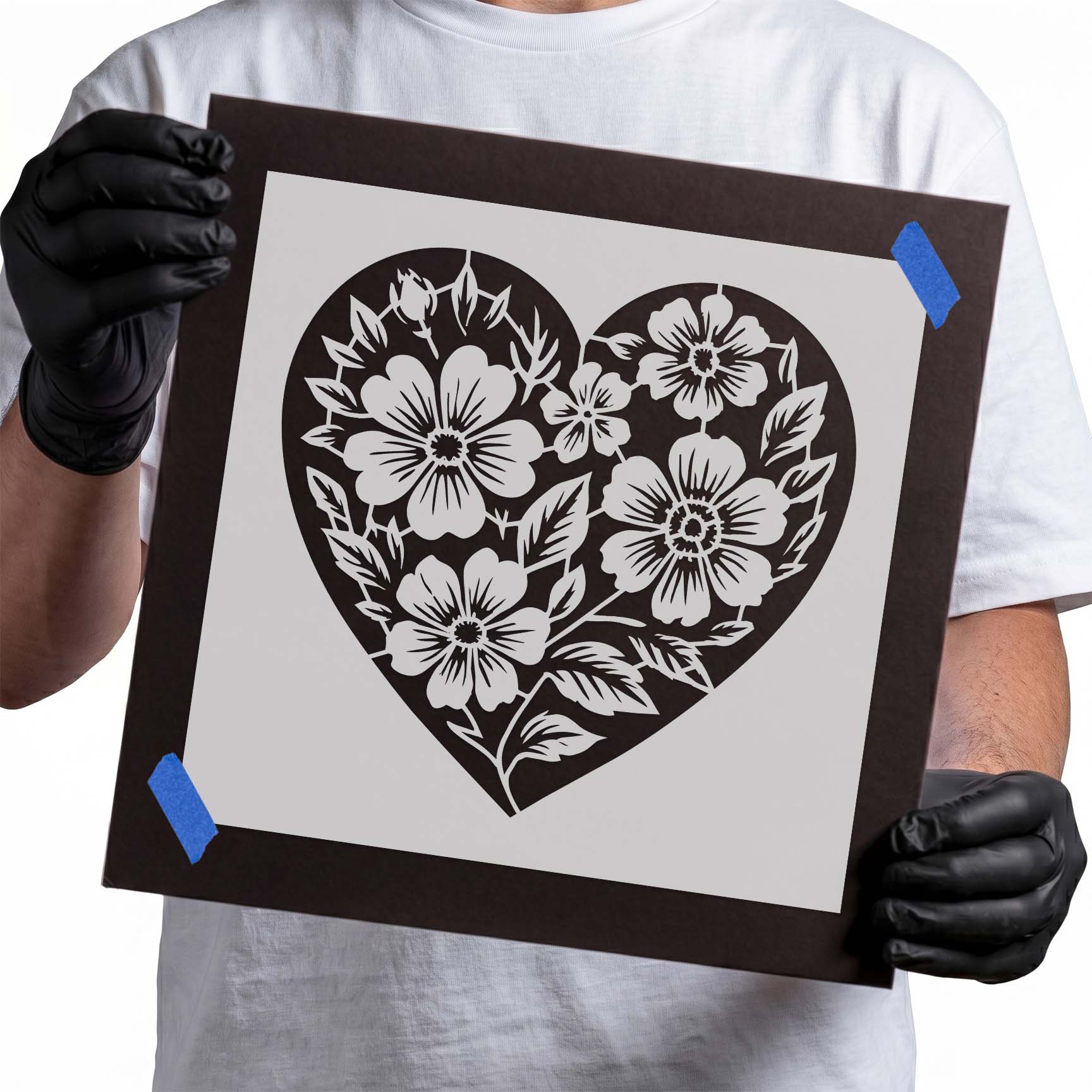 Heart stencil filled with blooming flowers and leafy botanical details