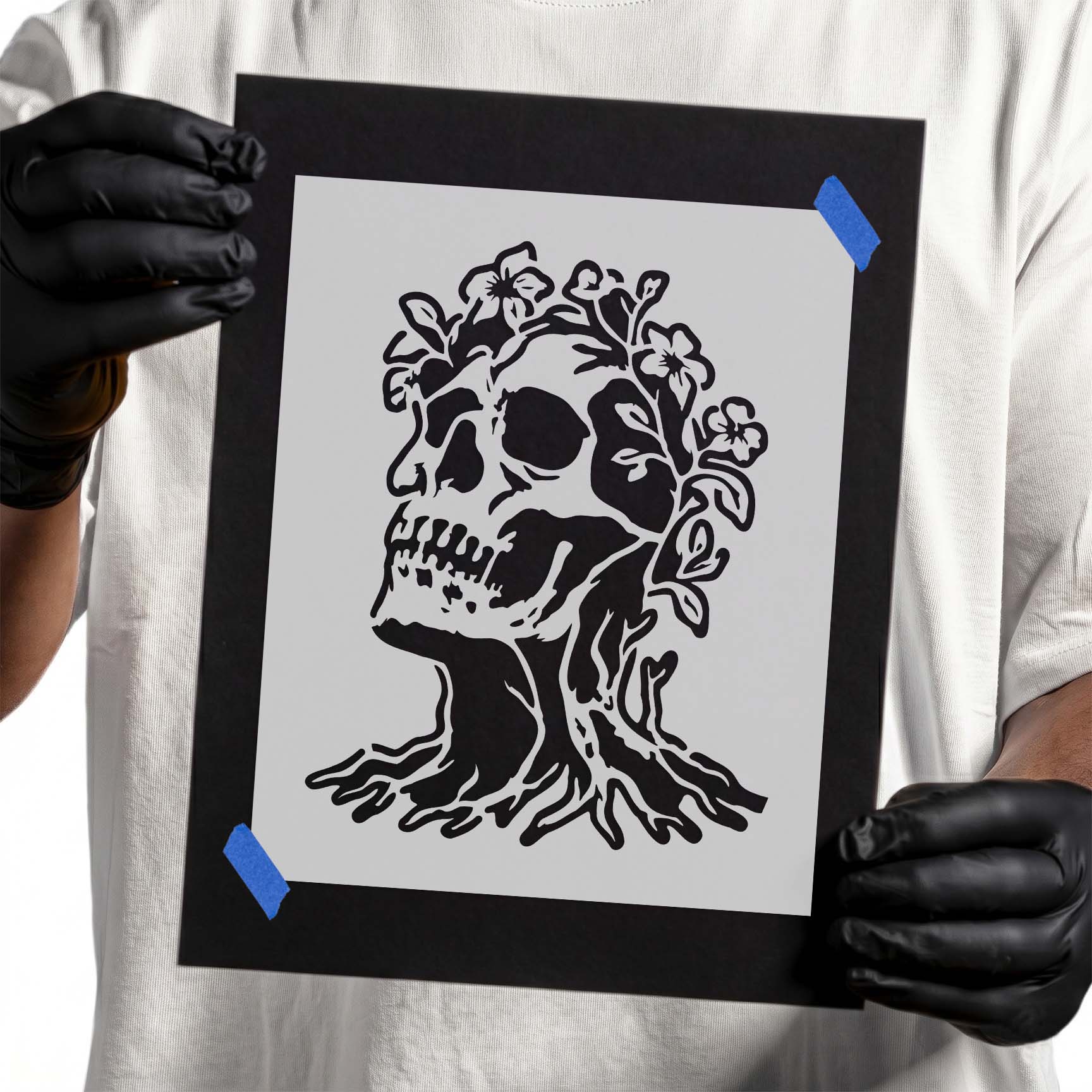 Detailed skull tree stencil with blooming flowers, exposed roots, and intricate botanical accents