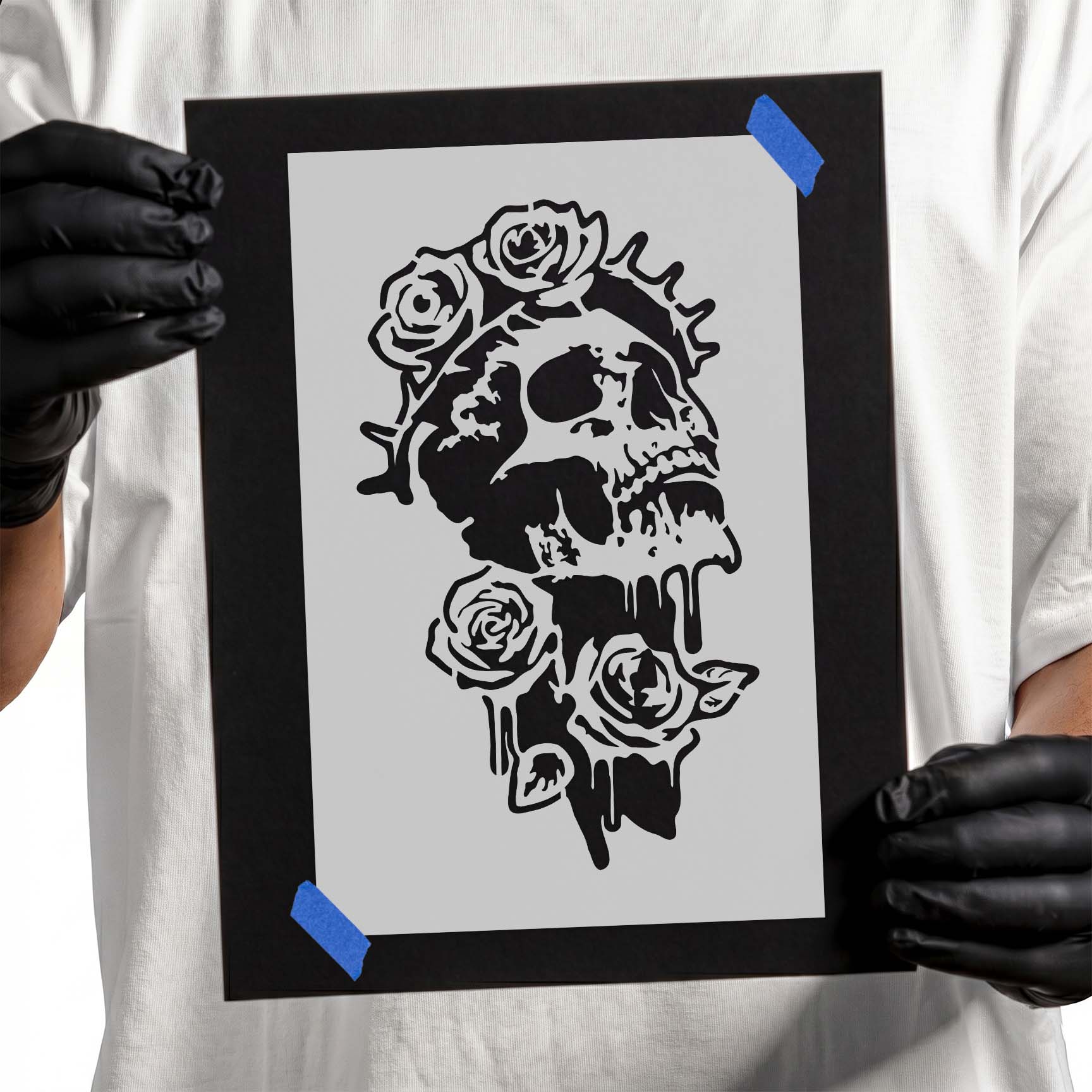 Detailed gothic skull surrounded by blooming roses with dramatic dripping accents