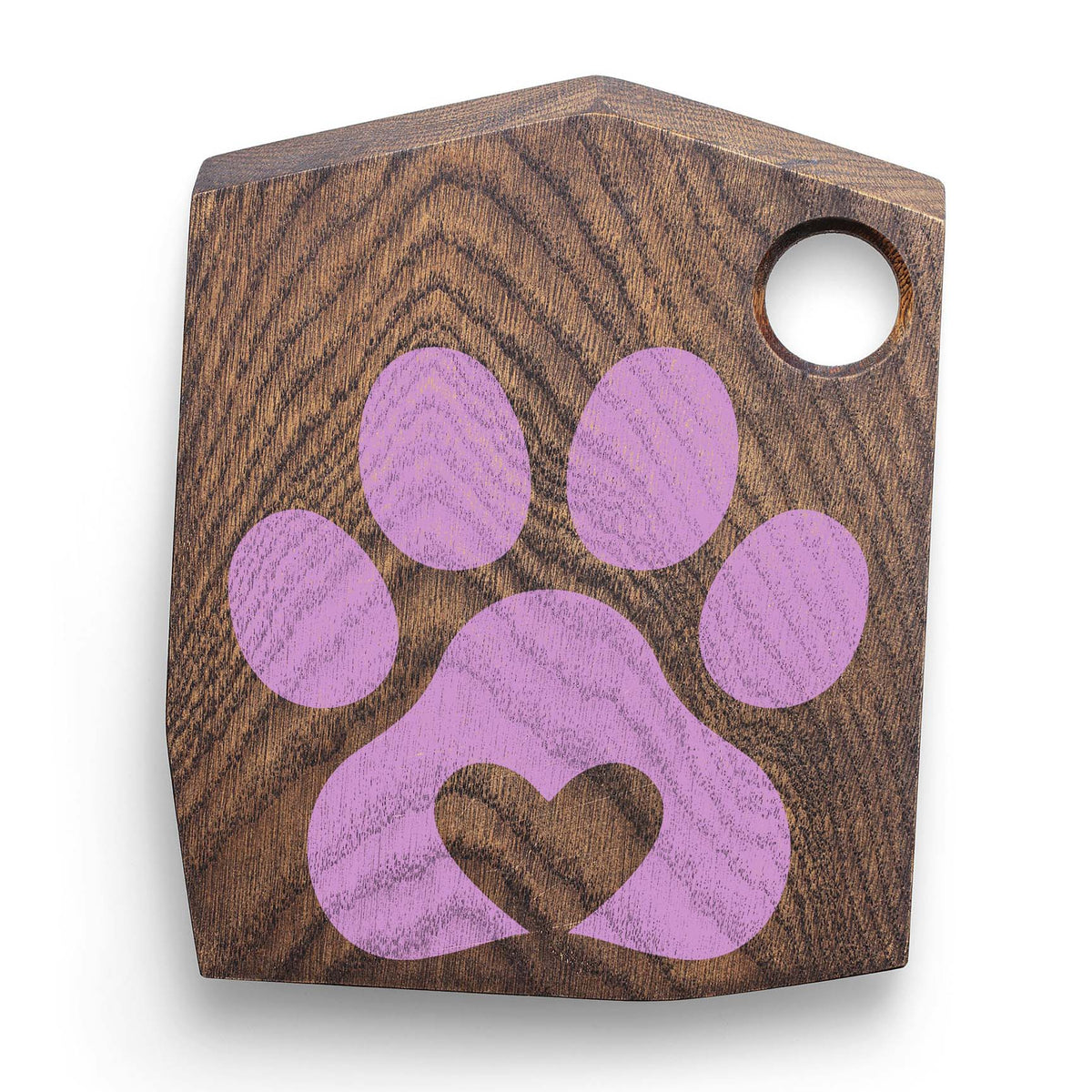 Heart Paw Print Stencil in soft purple decorates a dark wooden cutting board