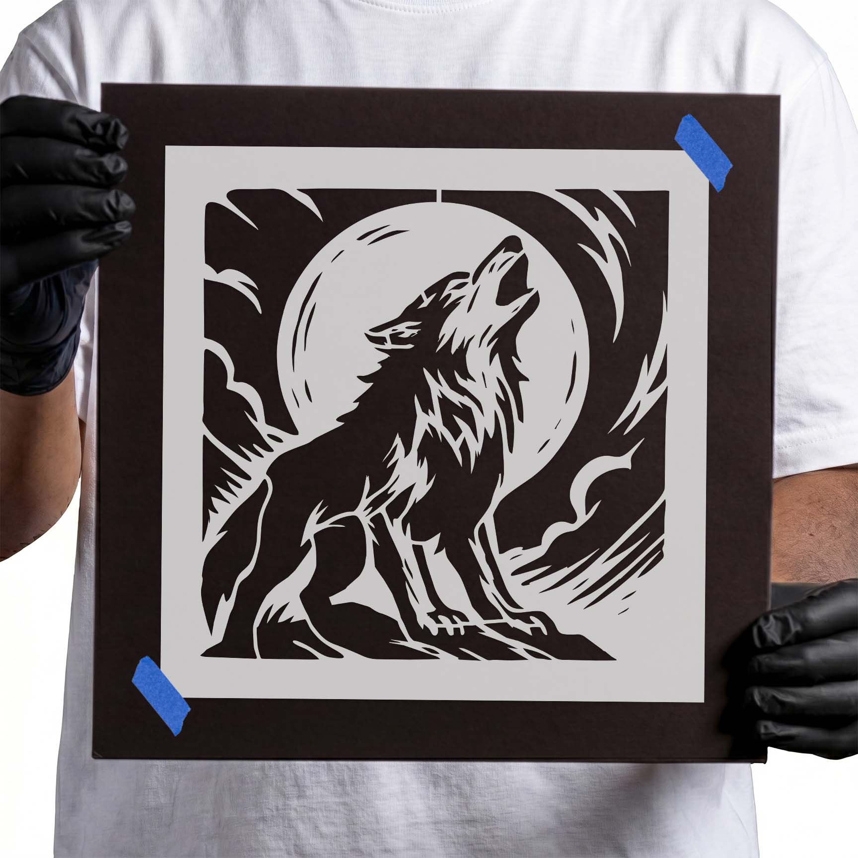 Howling wolf beneath a full moon with clouds stencil