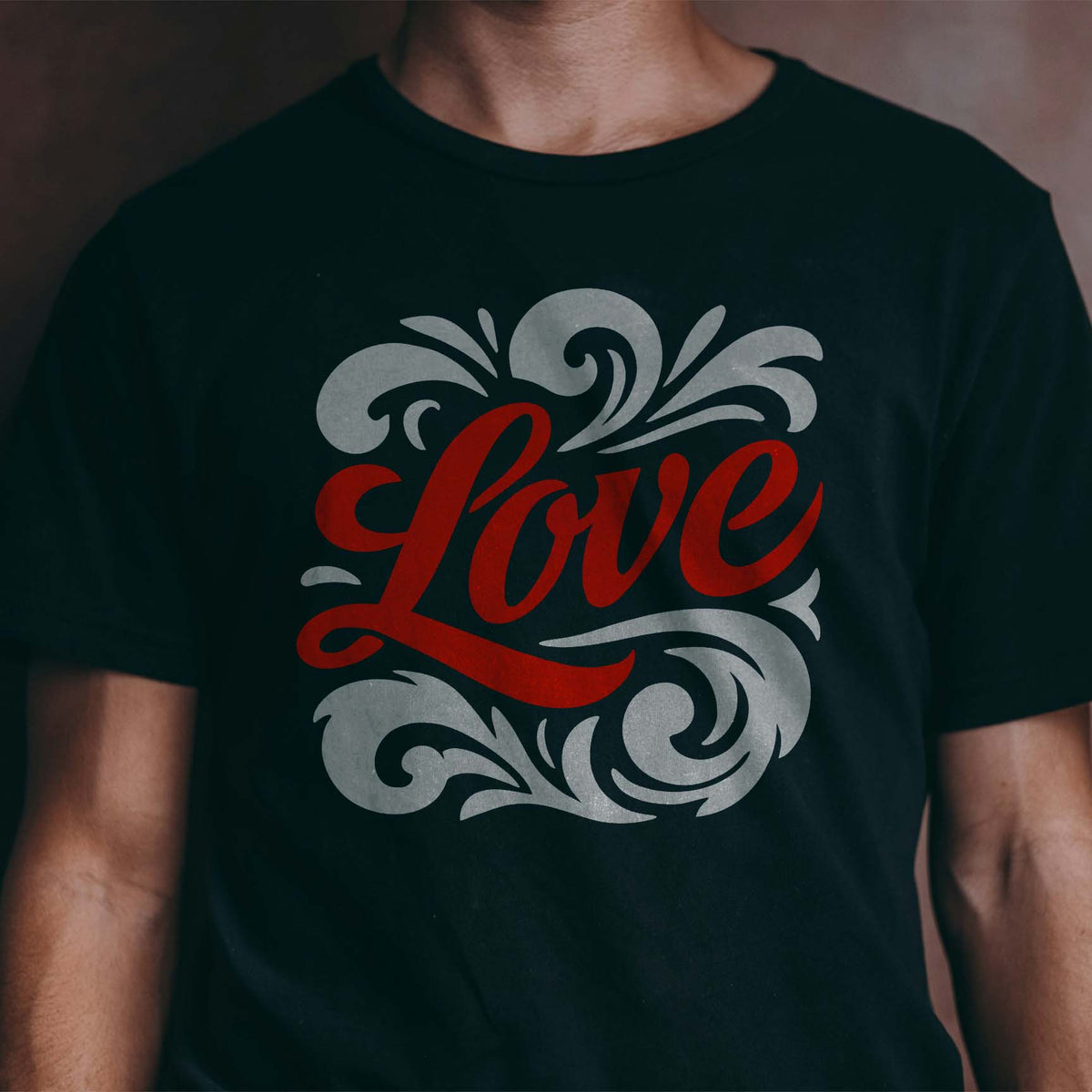 Love Script with Flourishes stencil featuring ornate swirls on a black shirt
