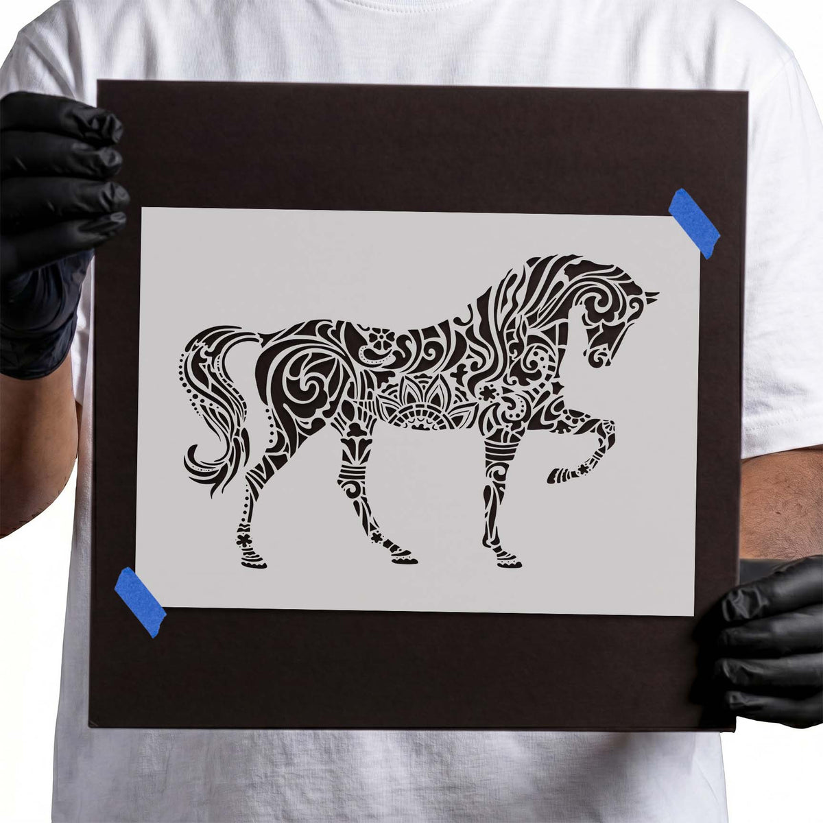Mandala Horse Stencil showing a graceful horse with a raised leg and intricate floral scrollwork
