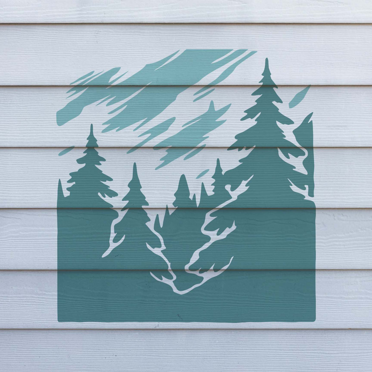 Misty Pine Forest stencil painted teal across white exterior siding