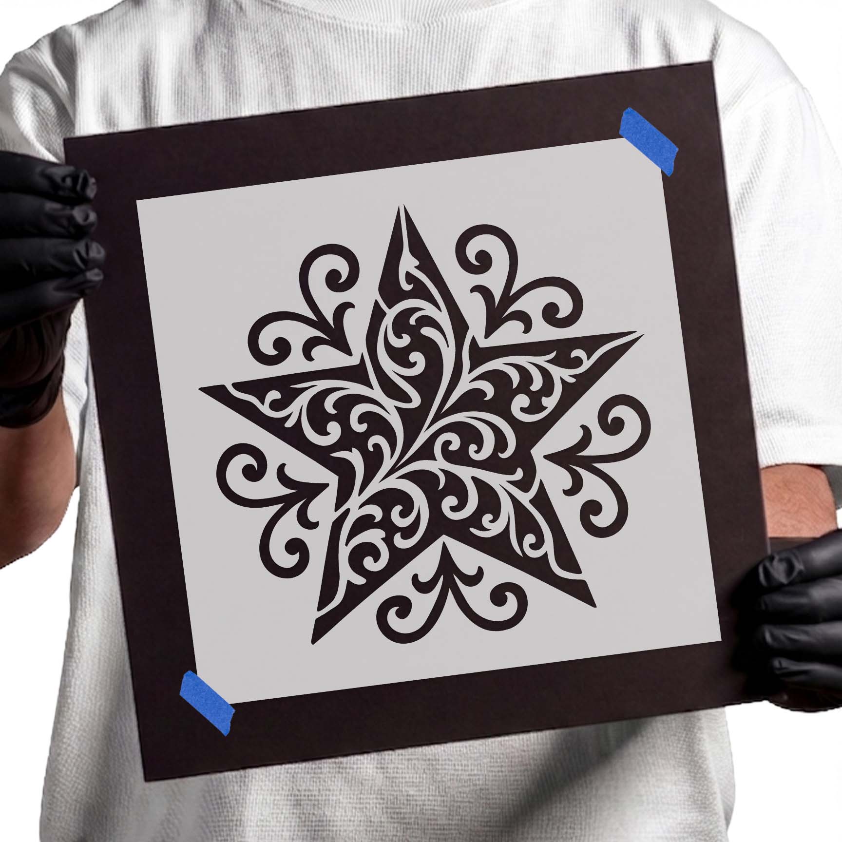Five-point star filled with ornate filigree scrollwork pattern