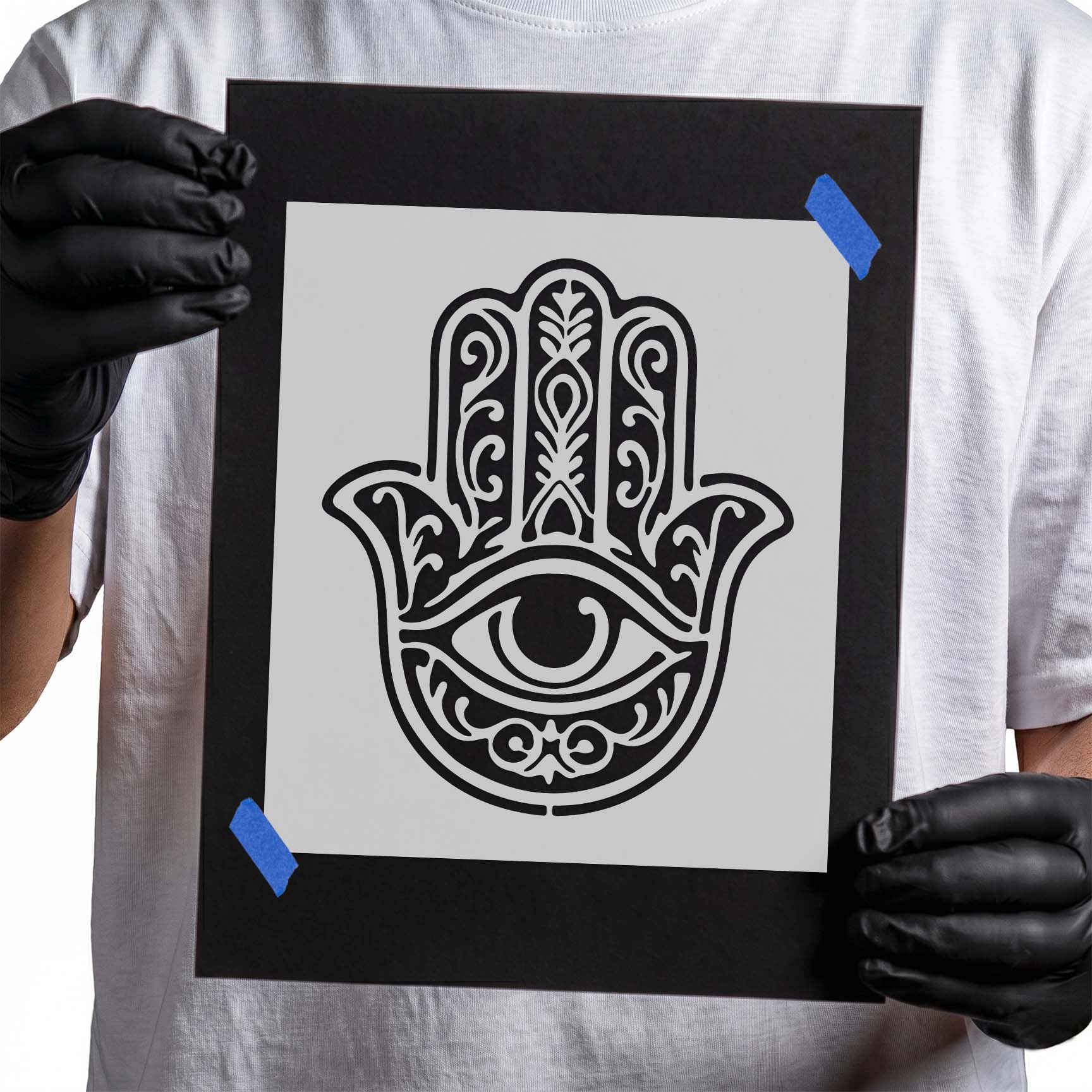 Ornate hamsa hand with central protective eye and decorative scrollwork