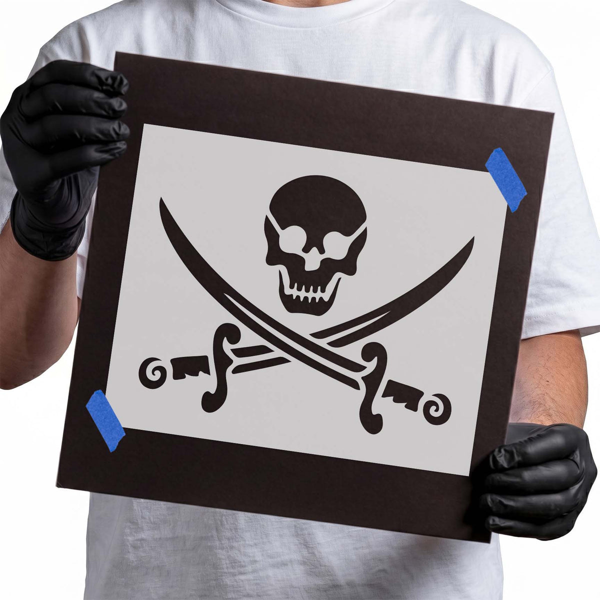 Pirate skull stencil above two crossed curved swords