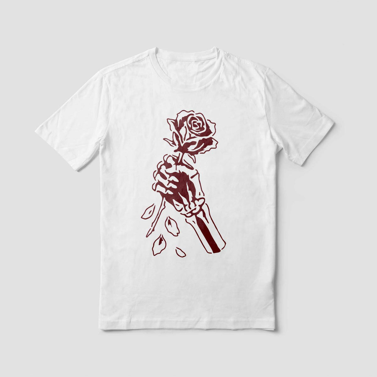 White shirt displays the Skeleton Hand Holding Rose Stencil in a striking dark red print