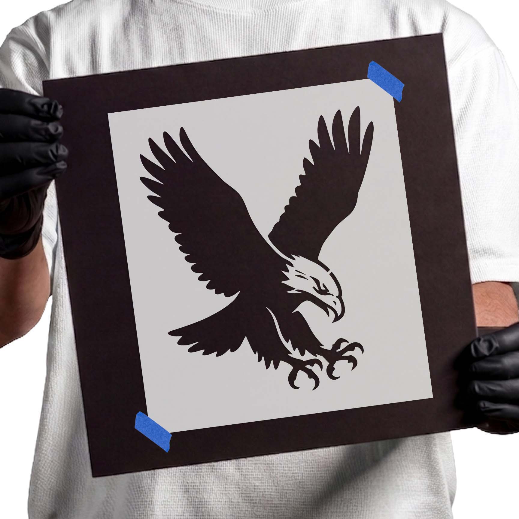 Detailed soaring eagle stencil with spread wings and extended talons in flight