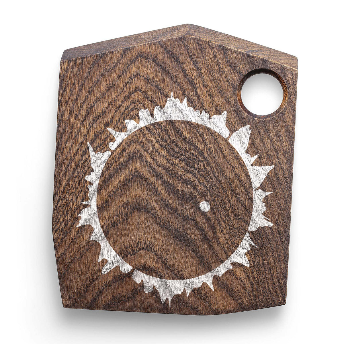 Rustic wood showcases the Solar Eclipse Corona Stencil in white around a dark circular center