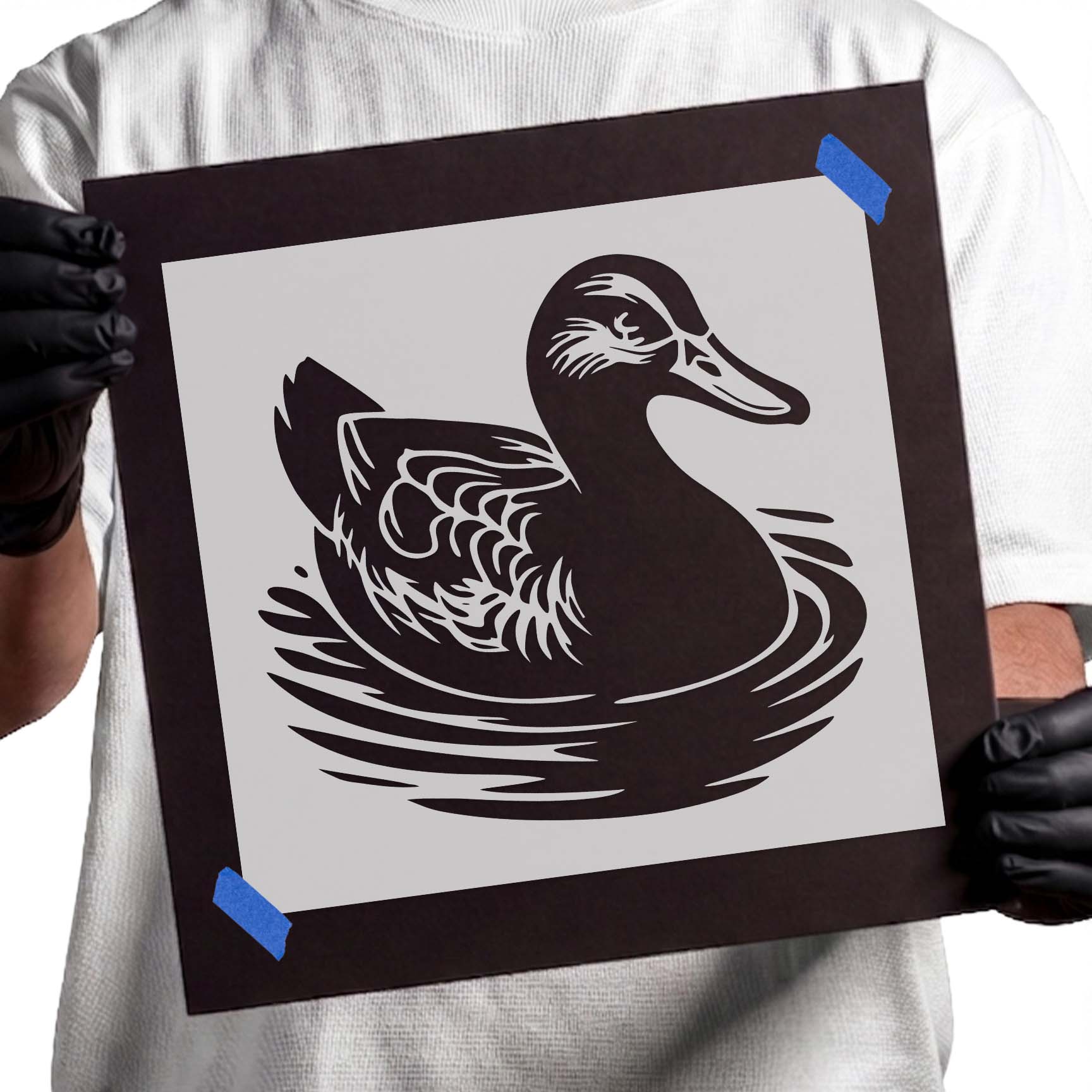 Mallard duck stencil swimming through rippling water with detailed wing markings