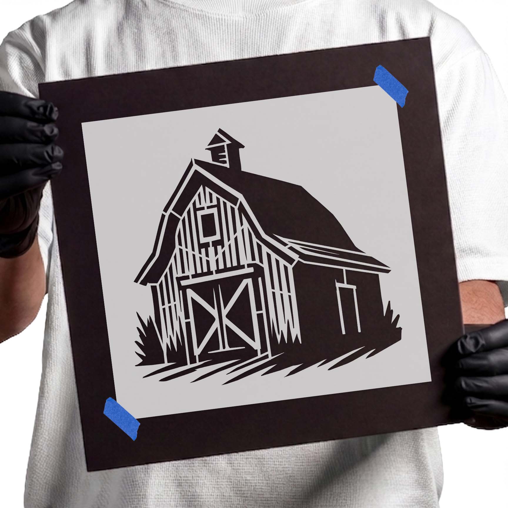 Person holding Traditional Wooden Barn reusable Mylar stencil