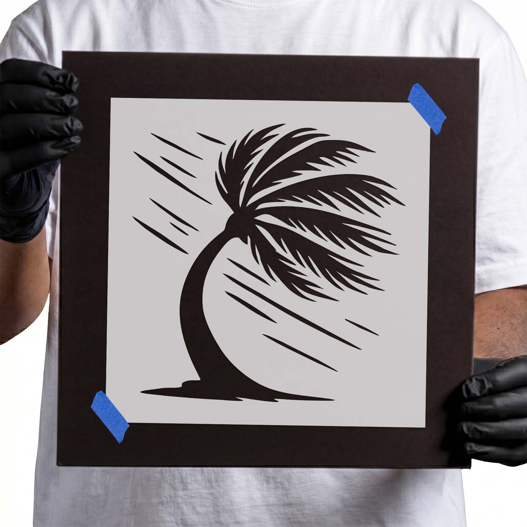 Windblown palm tree silhouette with sweeping tropical fronds