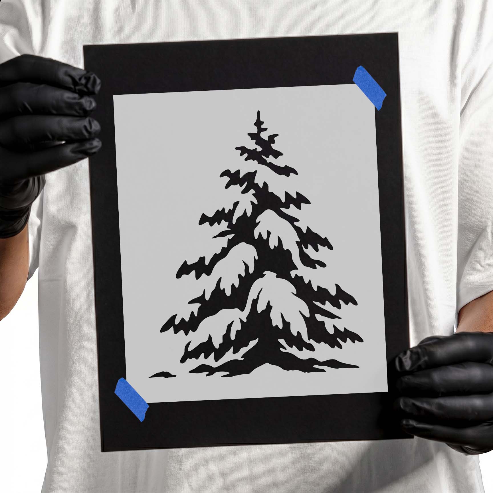 Snow-covered evergreen pine tree with layered branches in a peaceful winter setting