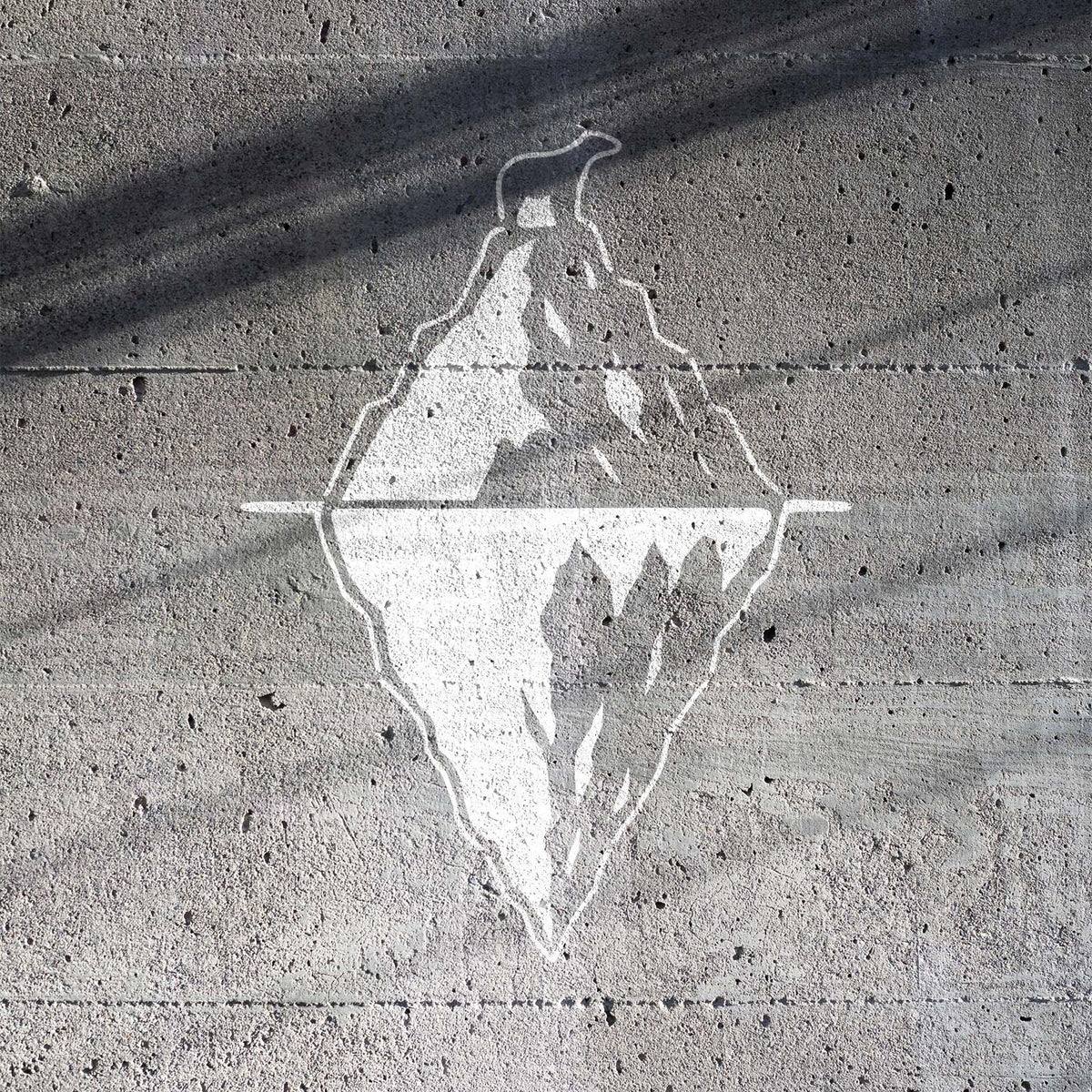 Polar bear iceberg illusion stencil creating an Arctic scene on concrete