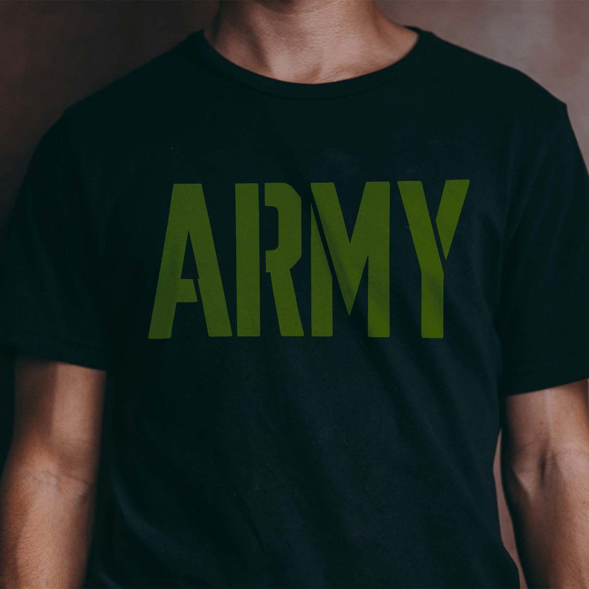 Army Word Stencil in olive green lettering printed across a black T-shirt.