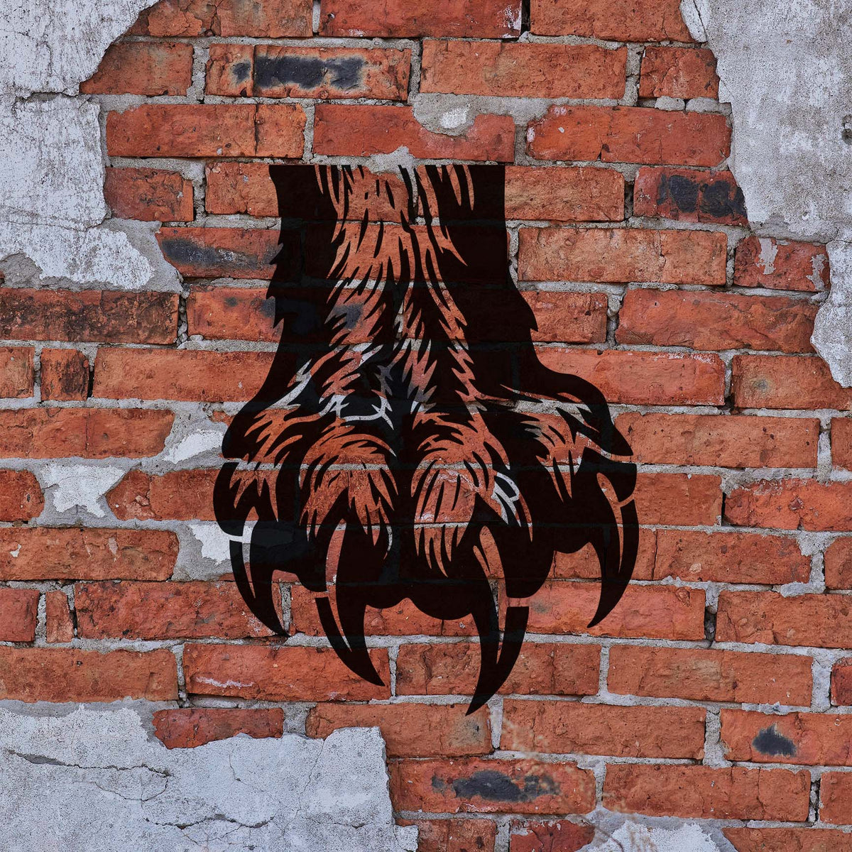 Fierce Bear Claw Paw Stencil stretches across exposed red brick with long curved talons