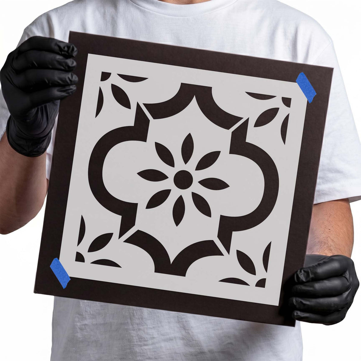 Symmetrical flower tile stencil with curved shapes and leafy corner details