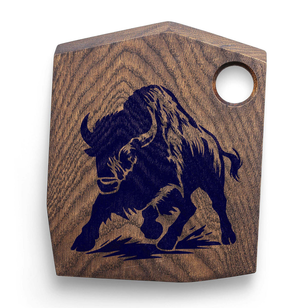 Stampeding Bison Stencil painted navy on a rustic wooden cutting board with curved horns.
