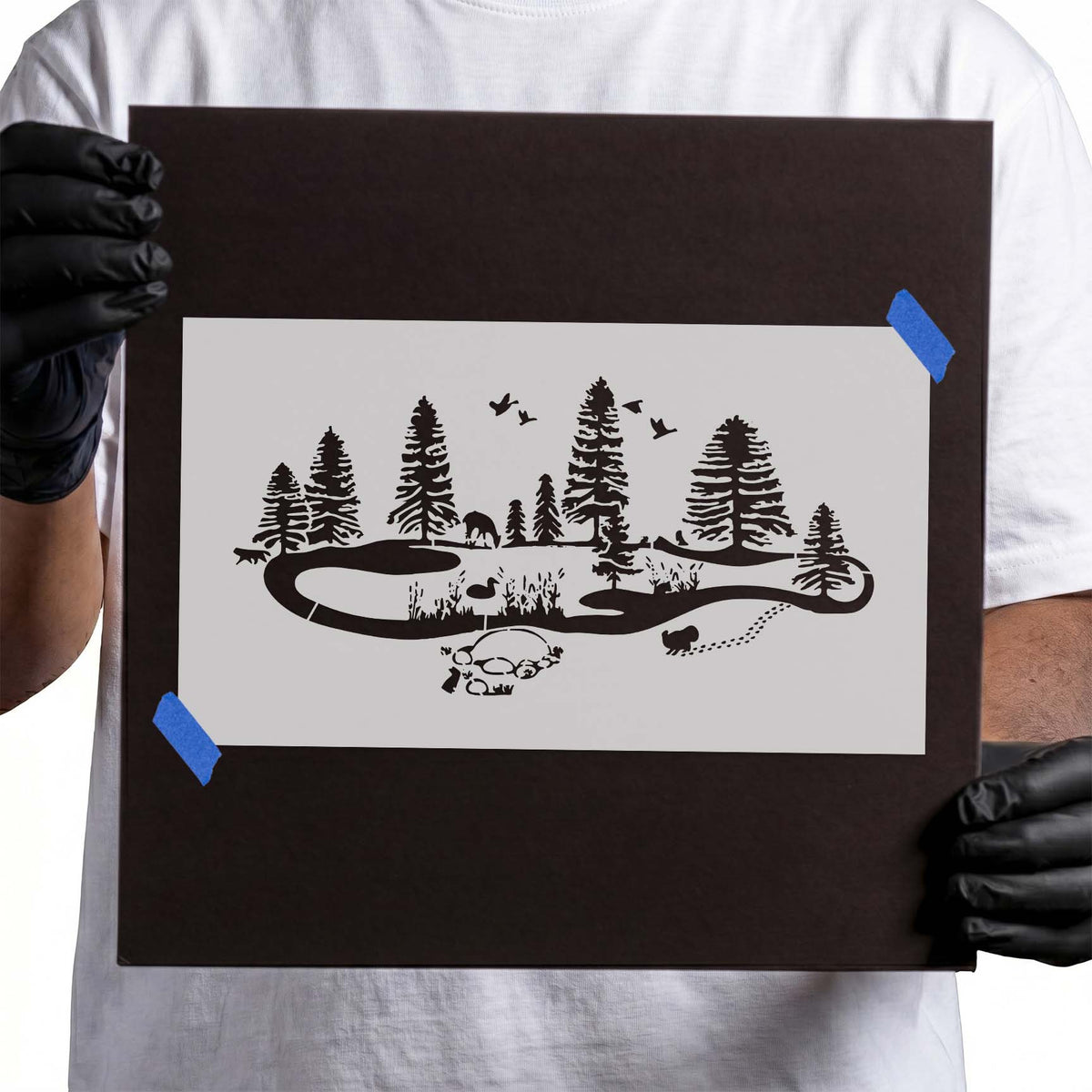 Forest stencil with winding trail, pine trees, wildlife, birds and campsite details