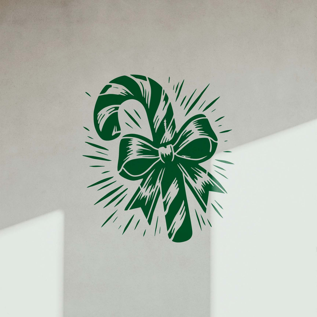 Candy Cane with Radiant Ribbon Stencil displays a bold green bow design on a light wall
