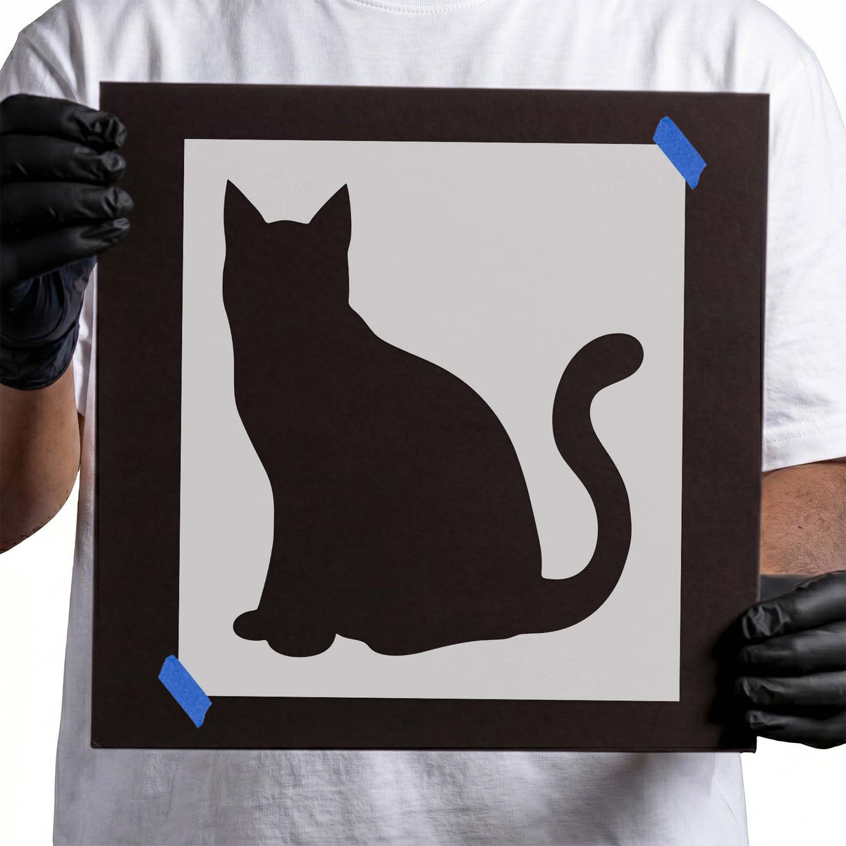 Cat Silhouette Stencil featuring a seated feline with pointed ears and a long upward-curled tail
