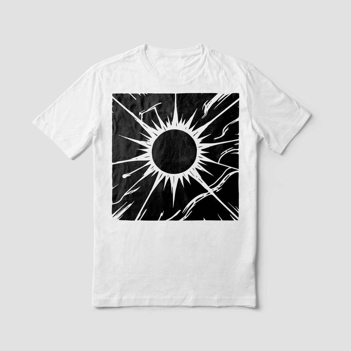 A white T-shirt showcases the Celestial Corona Stencil with bold black rays and cosmic details.