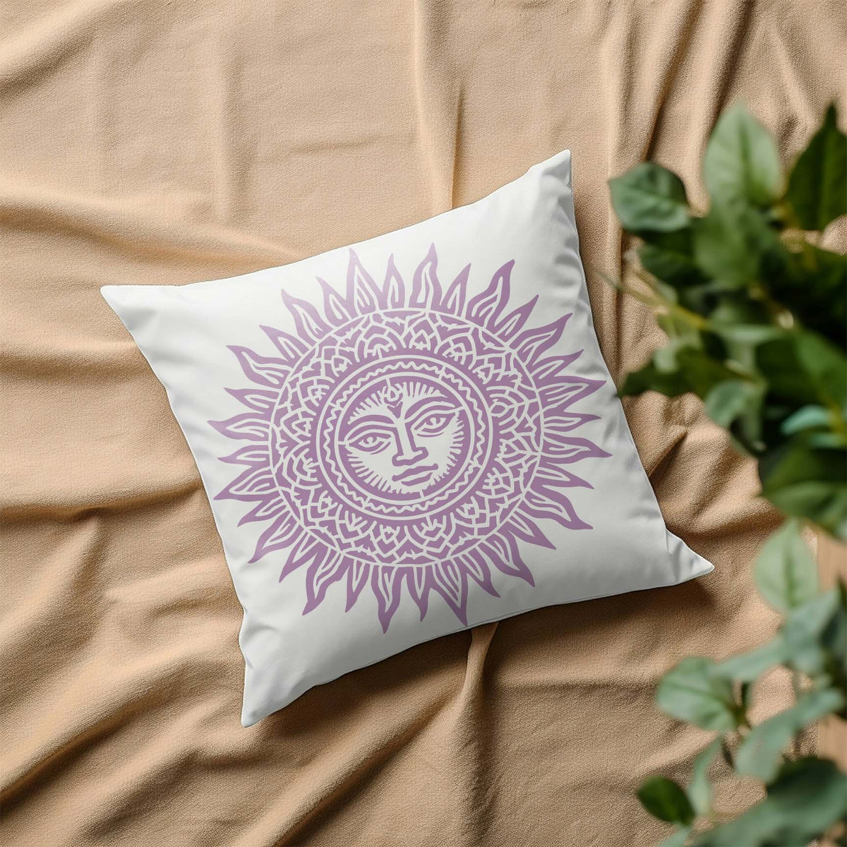A white pillow blooms with the Celestial Mandala Sun Stencil in soft lavender and ornate sun rays.