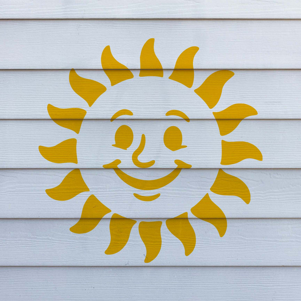 Golden rays and a playful grin bring the Cheerful Smiling Sun Face Stencil to life on white siding.