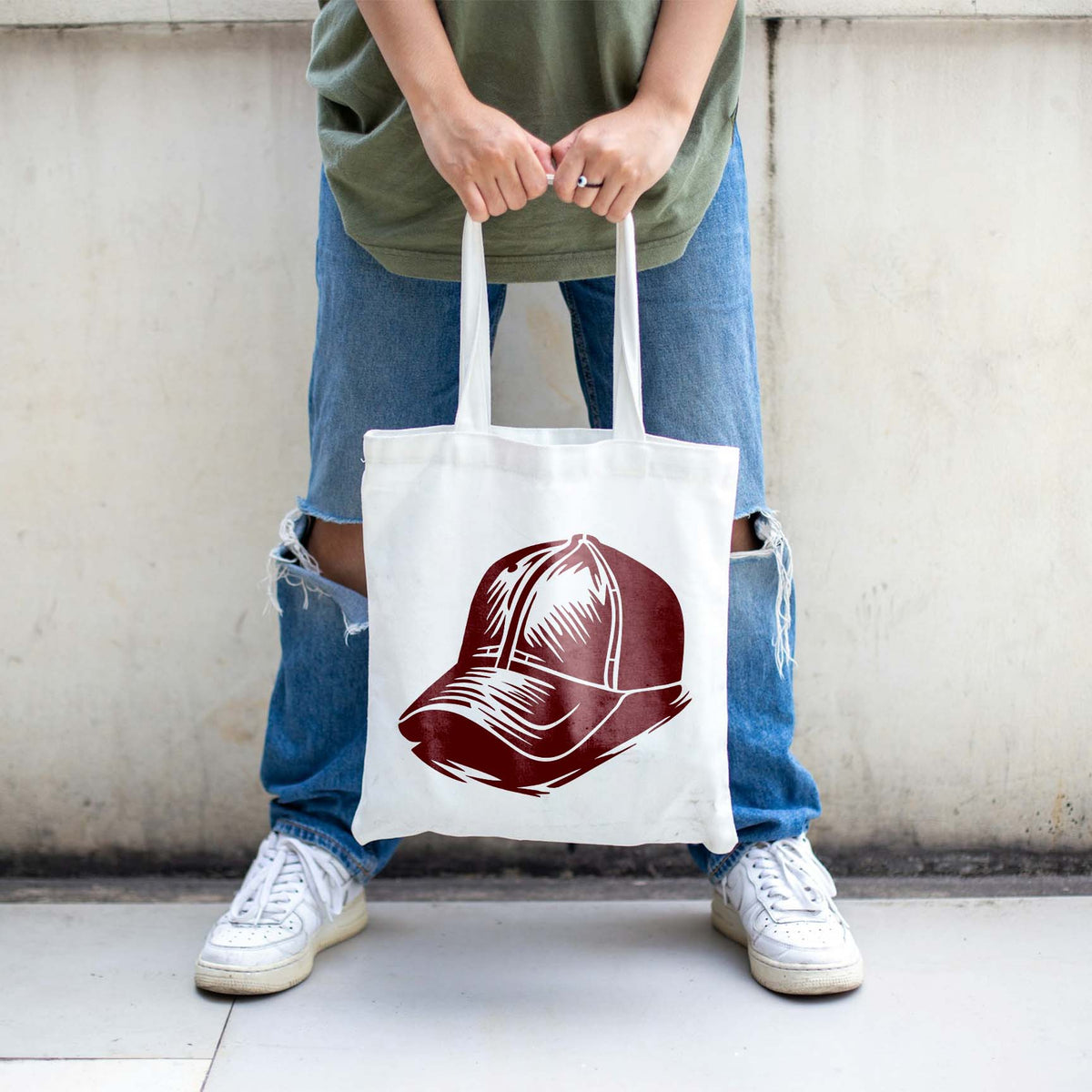 Vintage cap artwork from the Classic Baseball Cap Stencil appears in burgundy on a white canvas tote bag.
