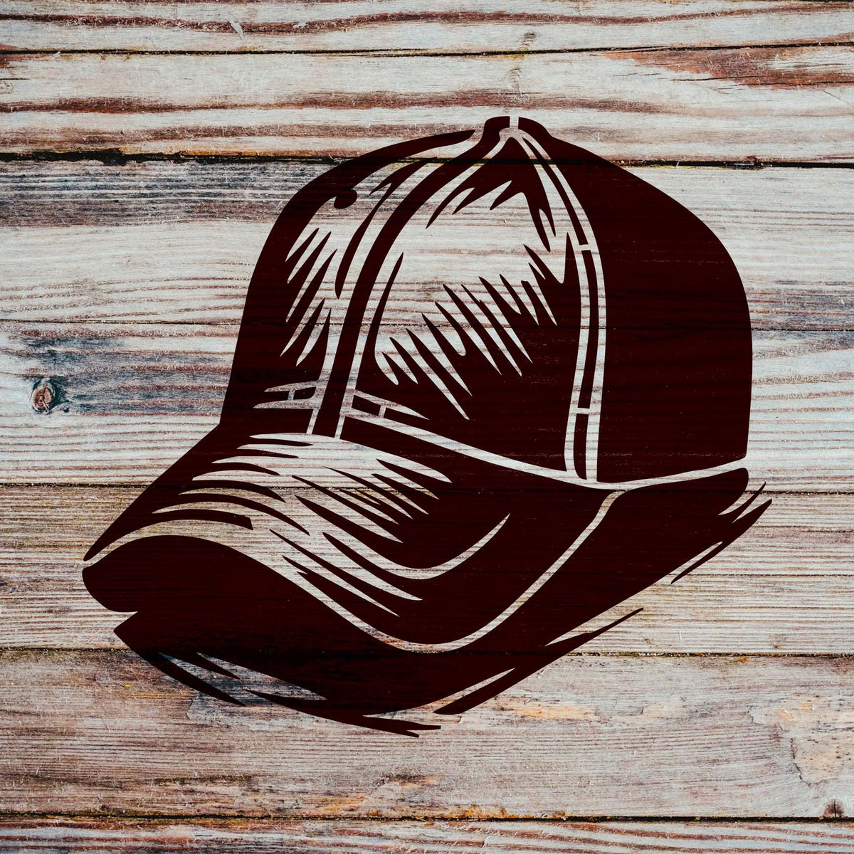 Bold shading defines the Classic Baseball Cap Stencil, painted in dark burgundy across rustic wooden planks.