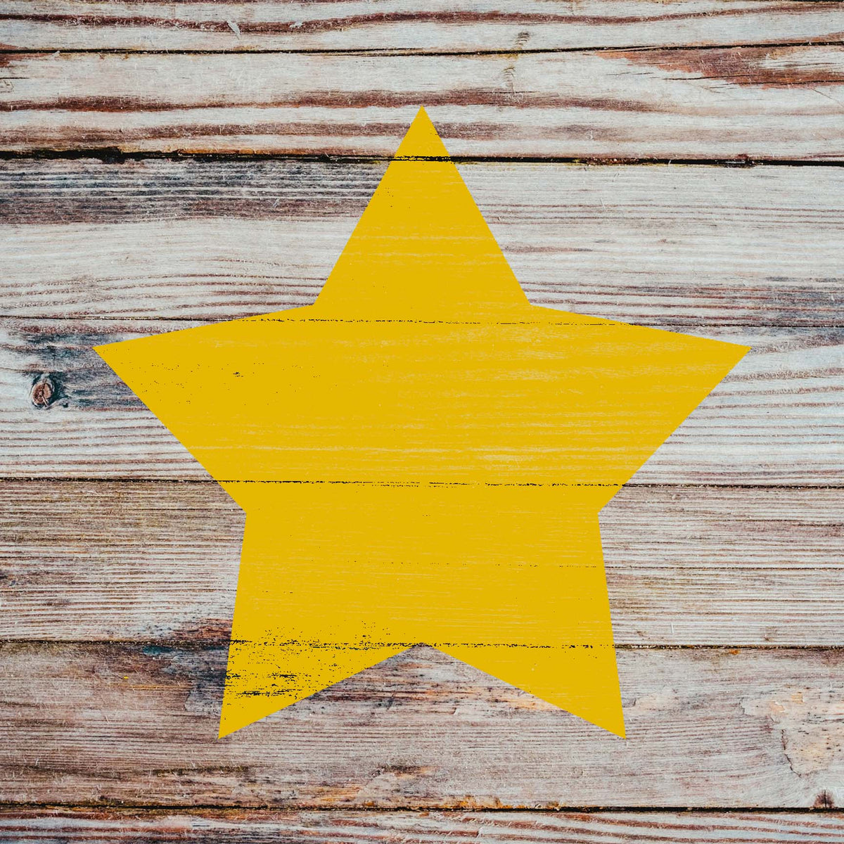 Rustic wooden planks showcase the Classic Five-Point Star Stencil in vibrant yellow with a weathered finish.