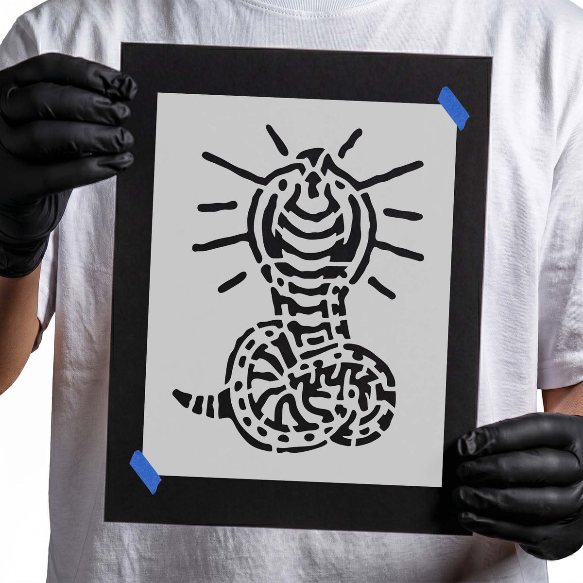 Coiled cobra stencil with raised hood and bold radiating accent lines