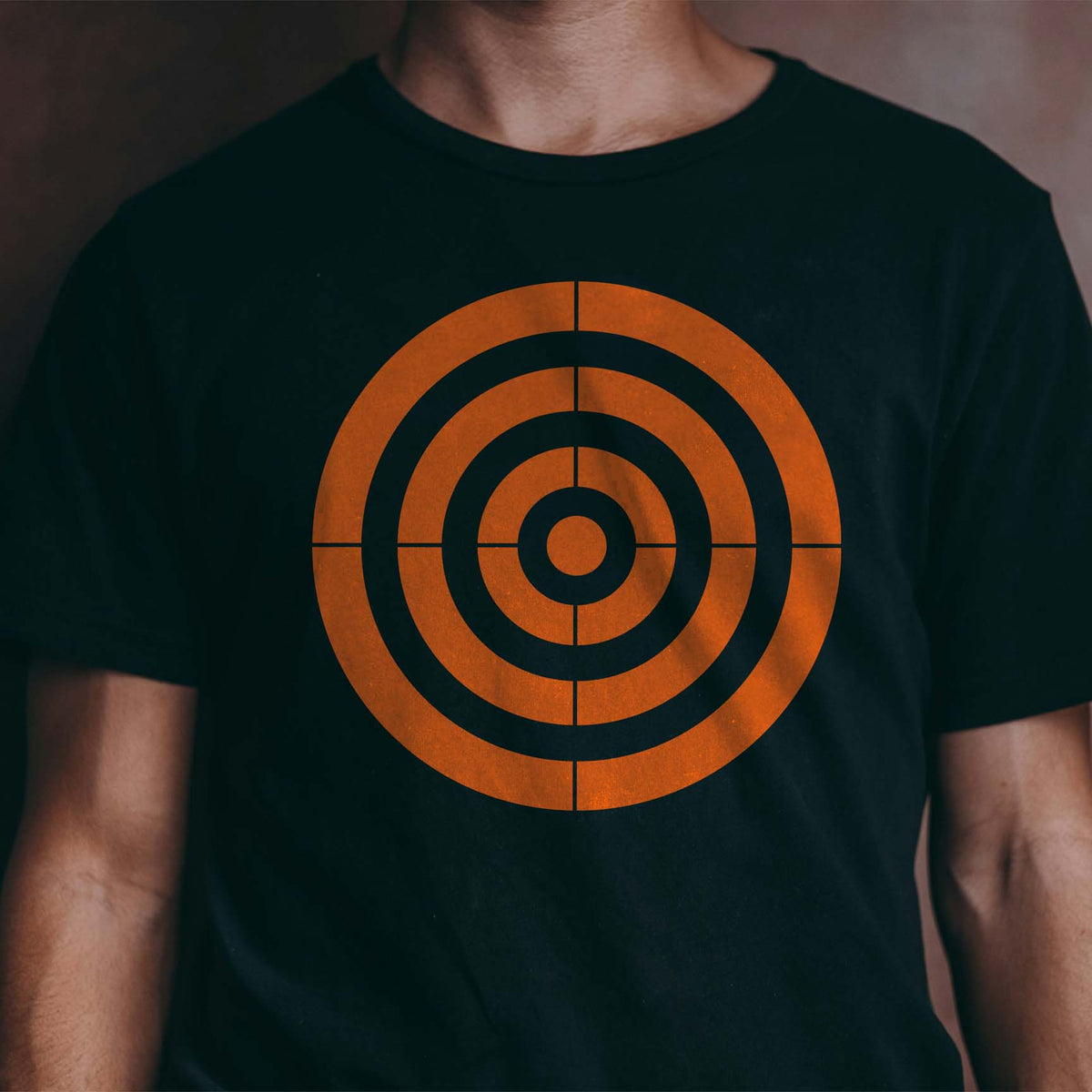 Bold orange Concentric Circle Target Stencil makes a striking graphic on a black shirt