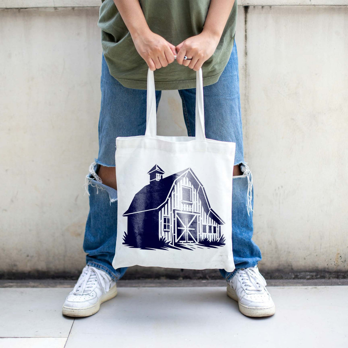 A white tote bag features Countryside Barn Facade Stencil in navy with classic barn doors and windows.