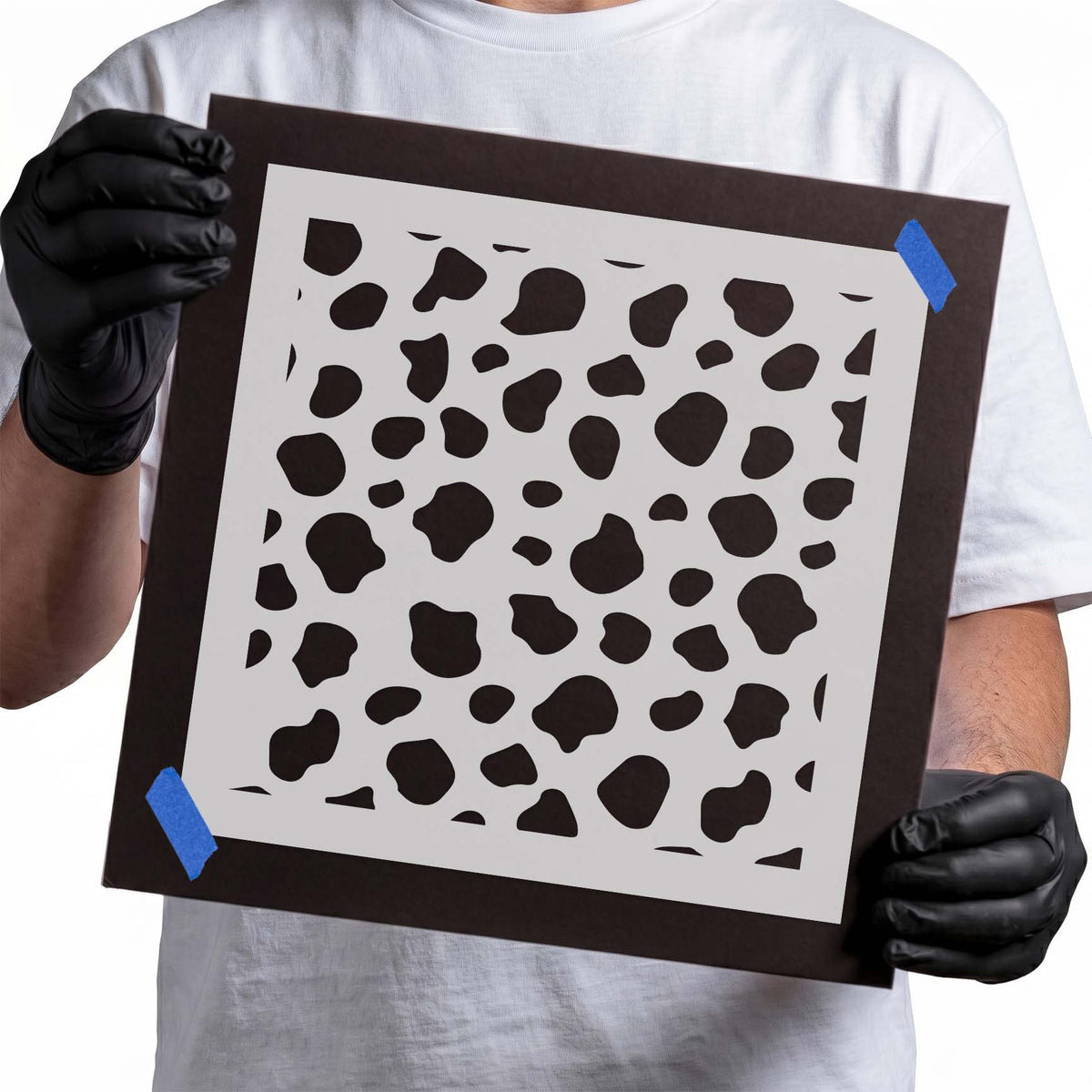 Playful Cow Print Stencil filled with varied irregular spots in an all-over pattern