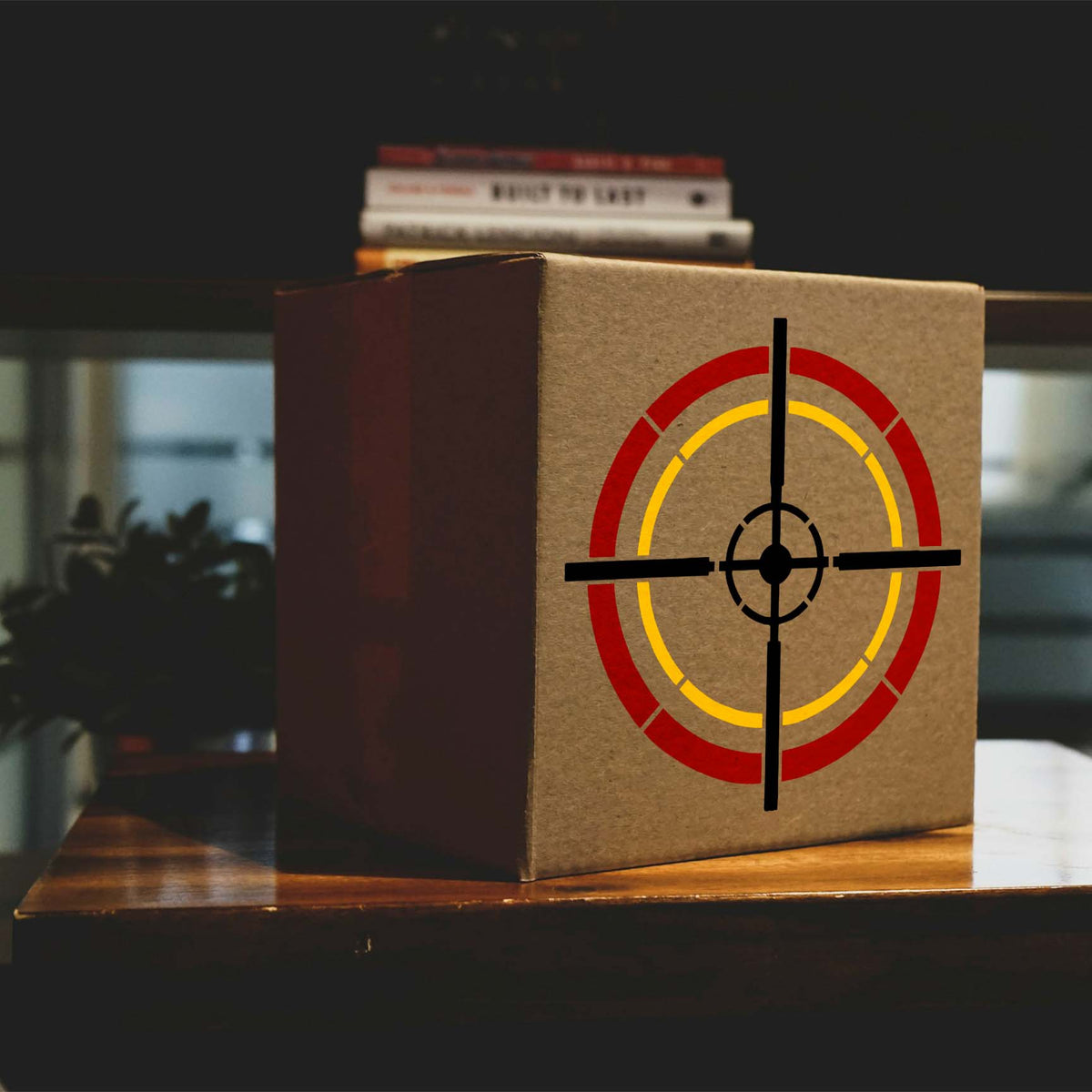 Tactical Crosshair Reticle Stencil adds red, yellow and black target rings to a cardboard box