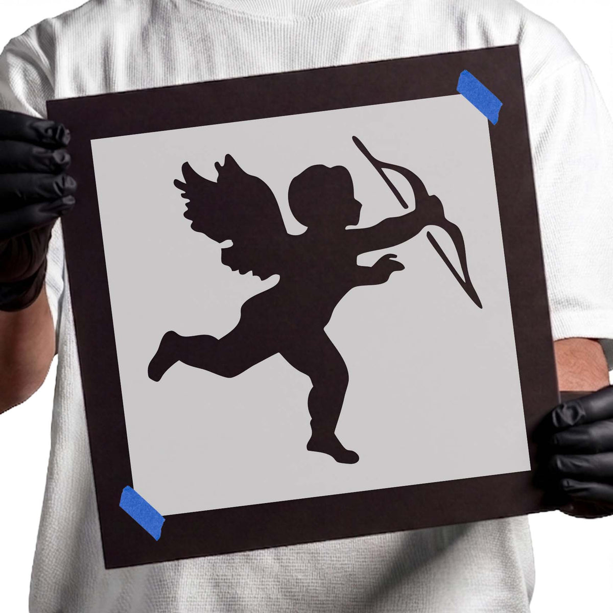 Cupid Stencil featuring a running winged cherub with raised leg and extended bow and arrow