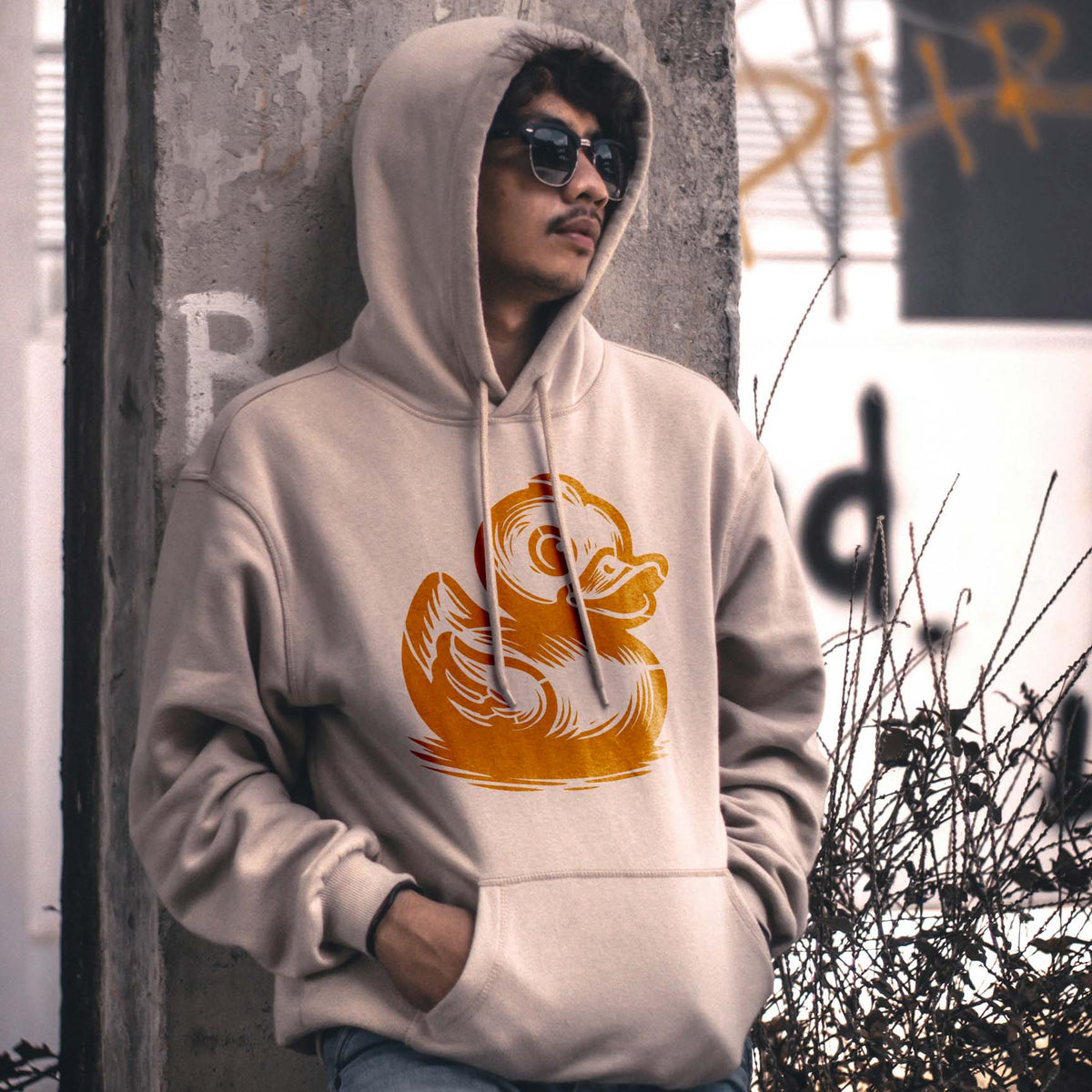 A beige hoodie features the Cute Rubber Duck Stencil in yellow across the front.