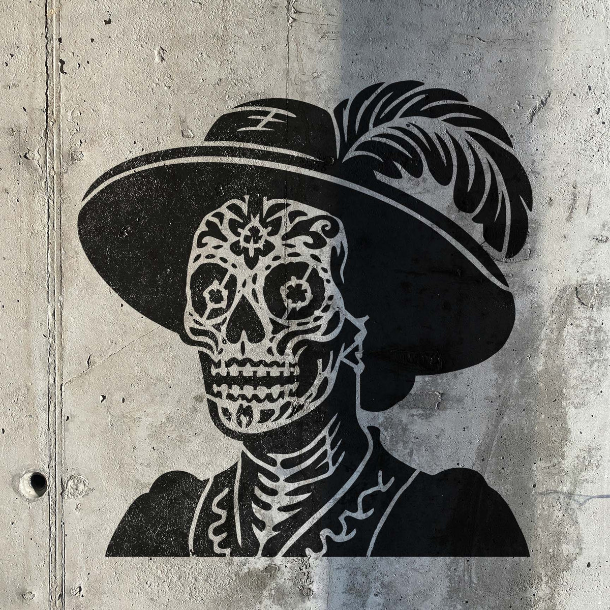 Bold Day of the Dead Lady Portrait Stencil painted black across a textured concrete wall