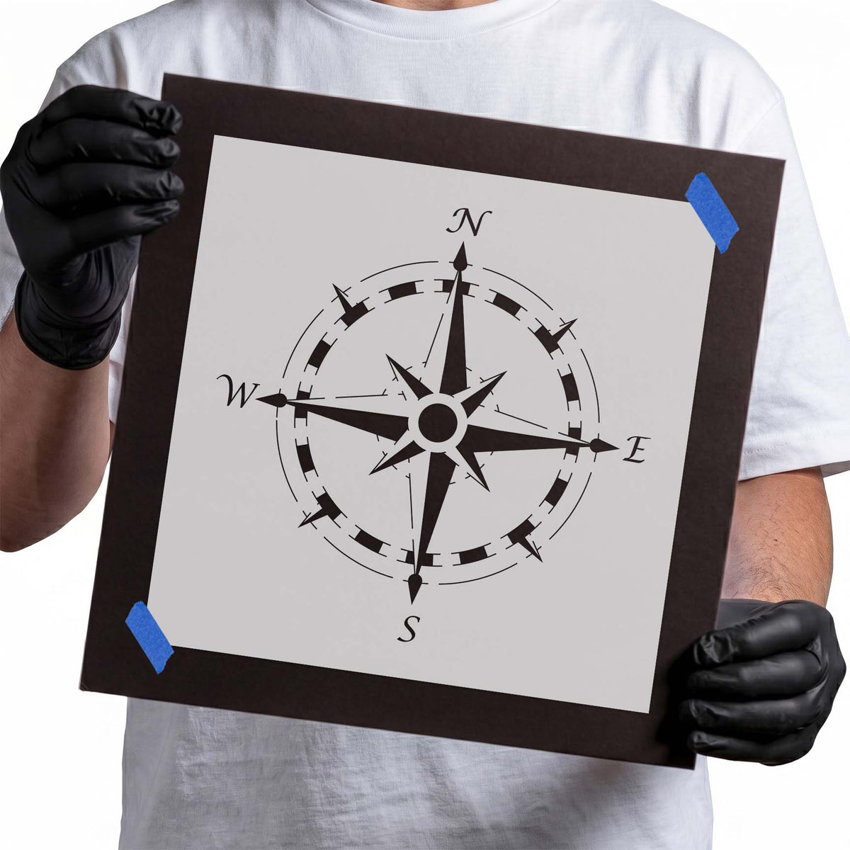 Detailed compass rose stencil with N S E W directional letters