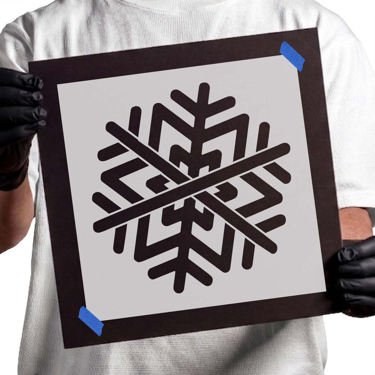 Detailed snowflake stencil with symmetrical geometric branches and angular pattern