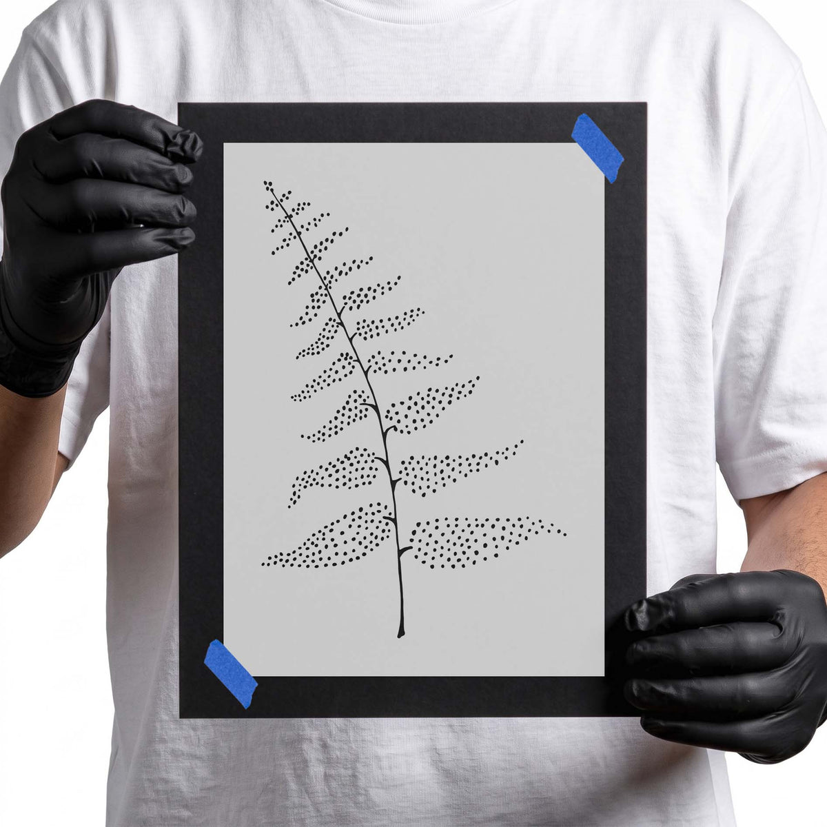 Dotted fern stencil with slender stem and layered botanical fronds