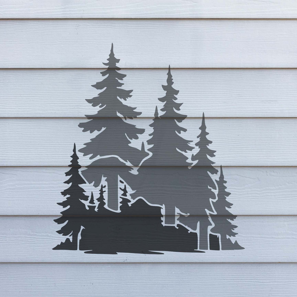 Evergreen Woodland Trees stencil forms a layered pine forest silhouette across white siding
